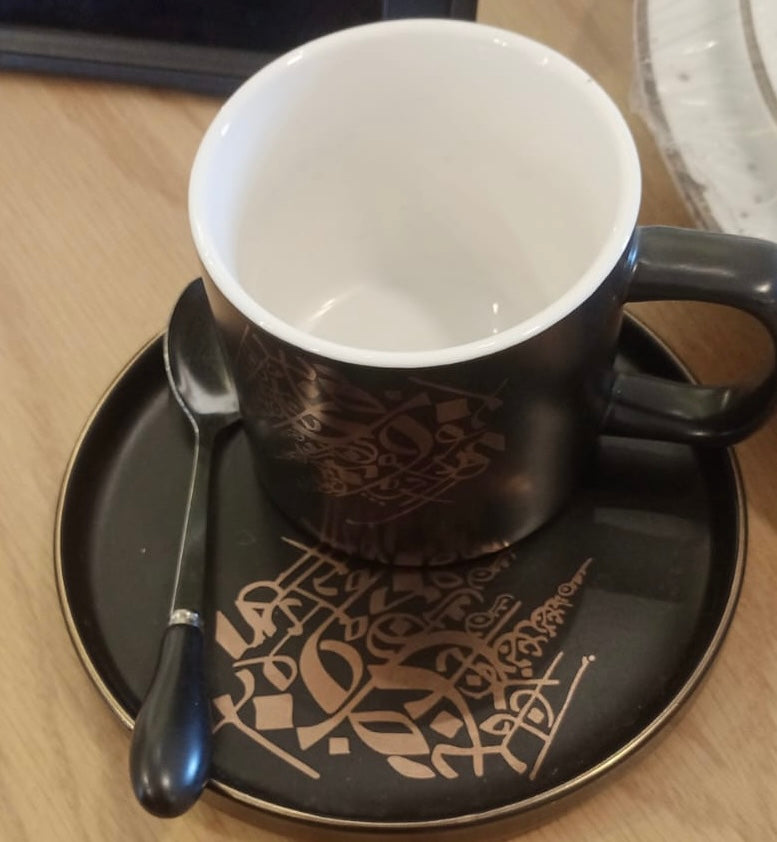 Black Calligraphy porcelain mug with a saucer and spoon