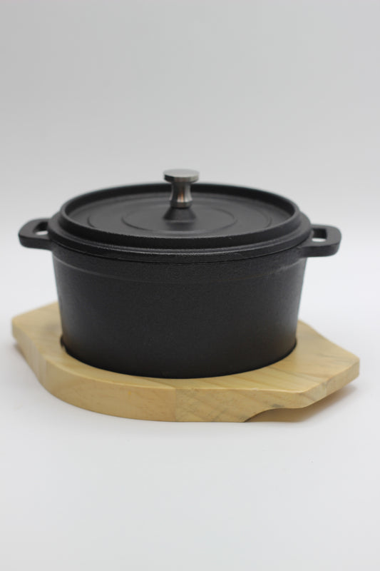 Cast Iron Pot with a Wooden Board