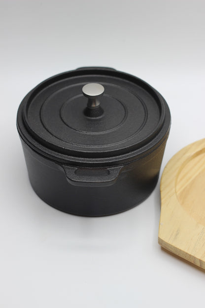 Cast Iron Pot with a Wooden Board