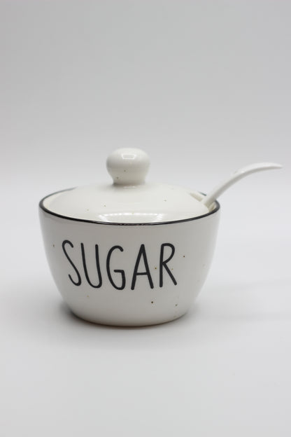 Titled sugar Pot with a spoon