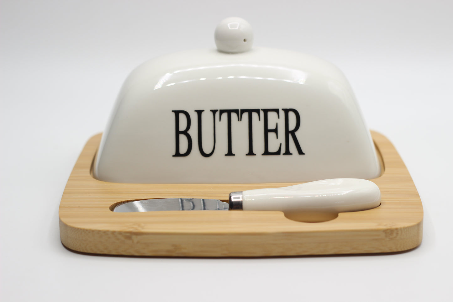 Butter and cheese plate with wooden base, knife and glass lid